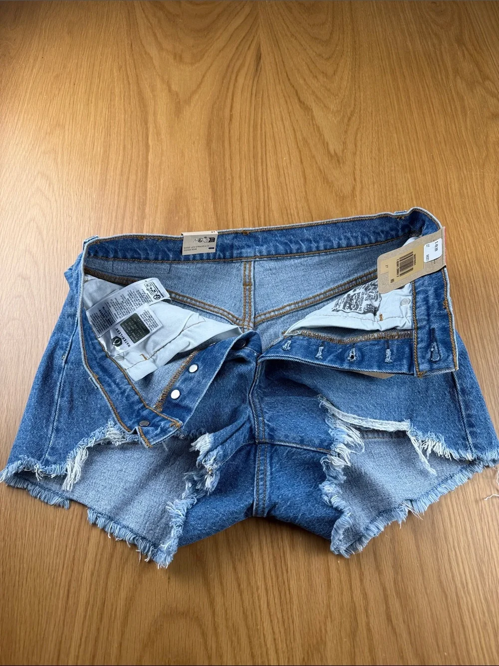 Levi's Women's 501 Light Blue Distressed Denim Cutoff Shorts 563270251 - Picture 3 of 5